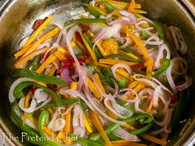 Jamaican escovitch fish pickling sauce in a saucepan