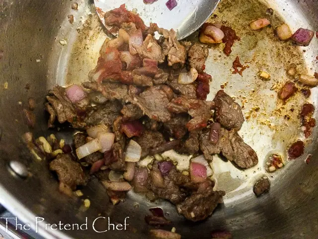 sliced beef in frying pan
