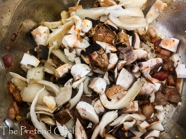 mushrooms added to Mushroom Soup in a pot