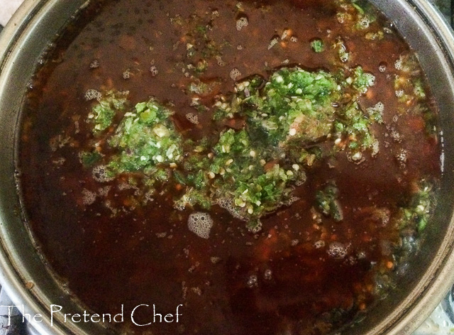 blended green peppers frying in palm oil for Ayamase, green ofada stew