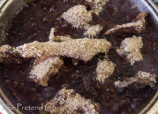 Ayamase, green ofada stew cooking in a pot