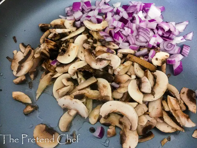 Mushroom and onions in a saucepan