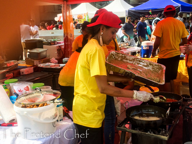 girl frying dough at taste of india toronto