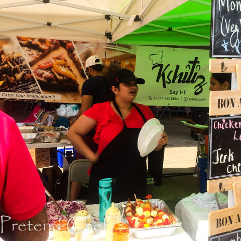 lady selling skewered fruits at taste of india toronto