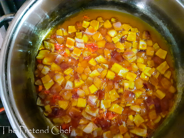 onions and pepper frying in palm oil