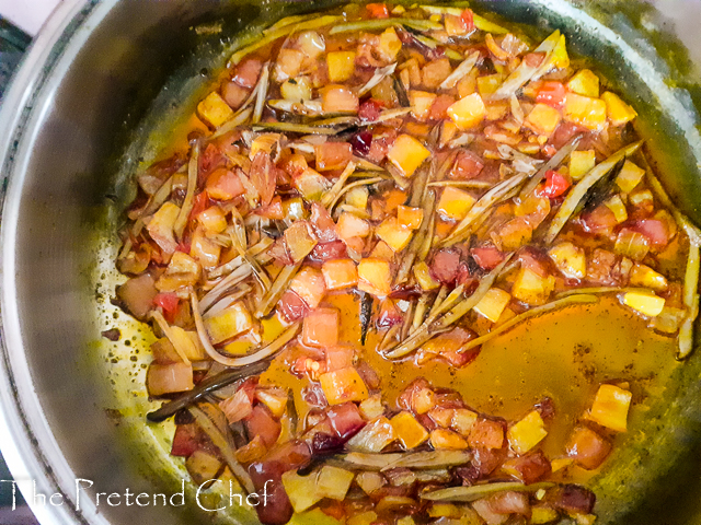 onions, pepper, ugba frying in palm oil