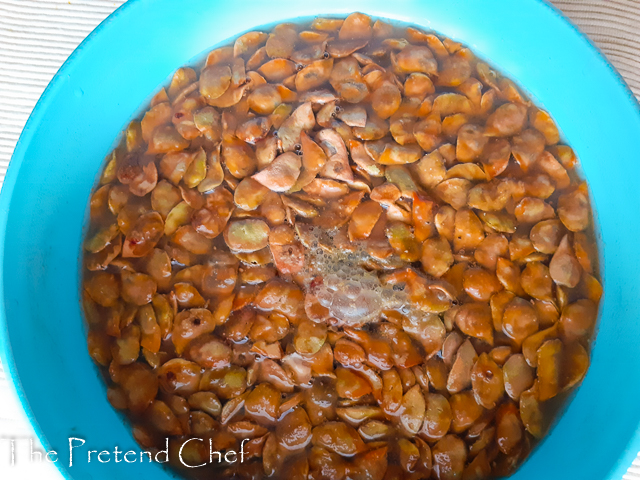 black Velvet Tamarind soaking in boiling water in a bowl