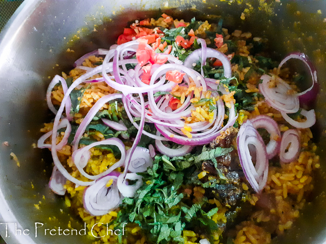 cooked banga jollof rice in a pot