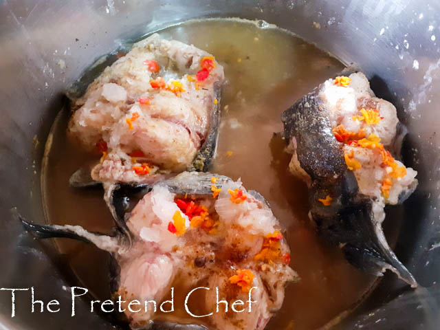 Cuts of Fresh catfish boiling in a pot