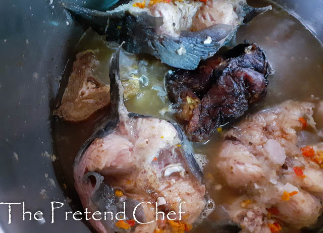 Cuts of Fresh catfish boiling in a pot