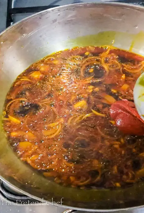 Tomato paste in frying onions