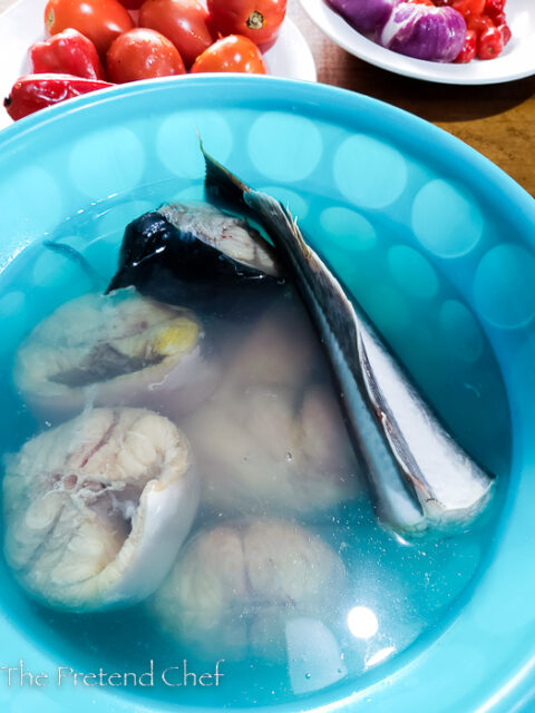 catfish steak soaking in hot water