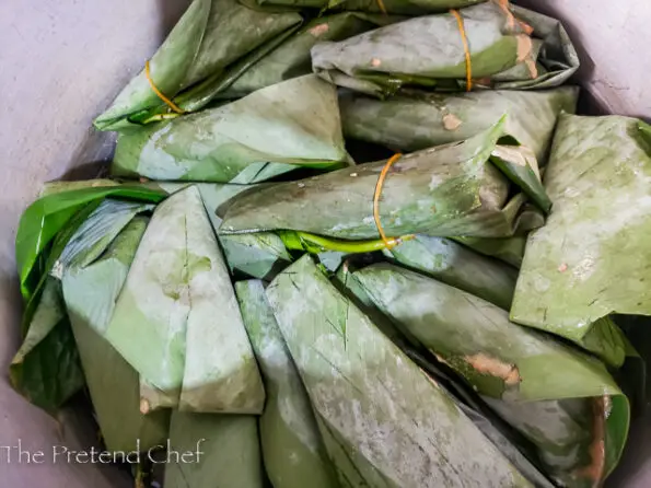 Moi moi wrapped in leaves ready for steaming