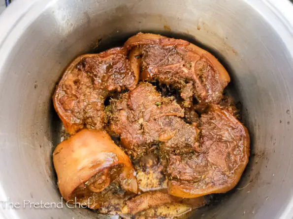 oxtail in cooking pot