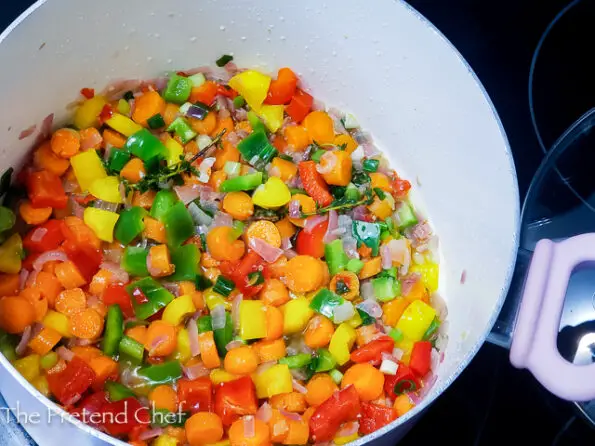 chopped vegetables frying in oil