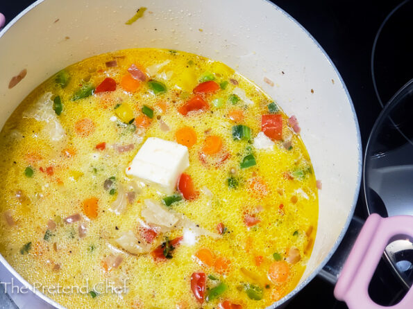 Jamaican Seasoned Rice cooking in a pot