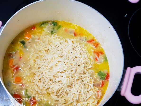 Jamaican Seasoned Rice cooking in a pot