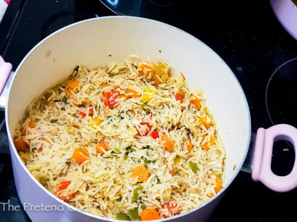 Jamaican Seasoned Rice cooking in a pot